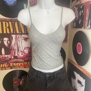 Fitted xs light green top with adjustable straps and tactile flower design